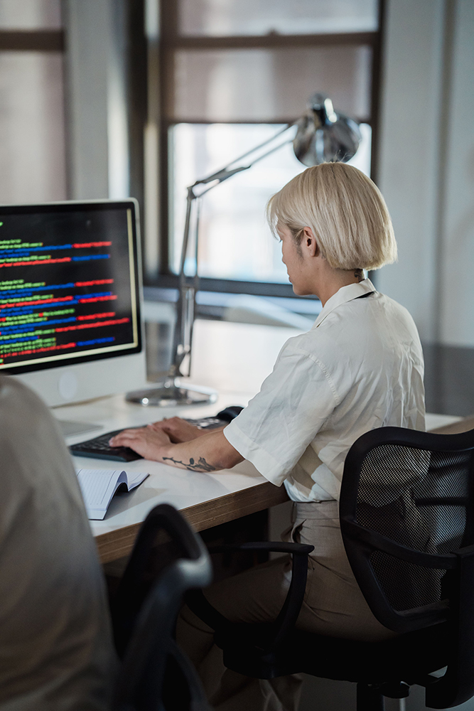 Woman working at a modern computer workstation